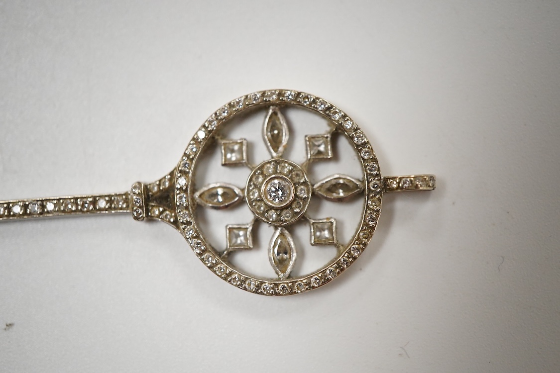 A mid 20th century white metal and diamond cluster set 'key of the door' pendant. 51mm, gross weight 4.6 grams.